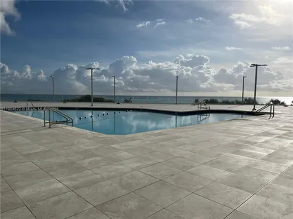 a view of a swimming pool with a balcony