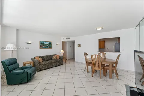 a kitchen with granite countertop a sink and a stove top oven