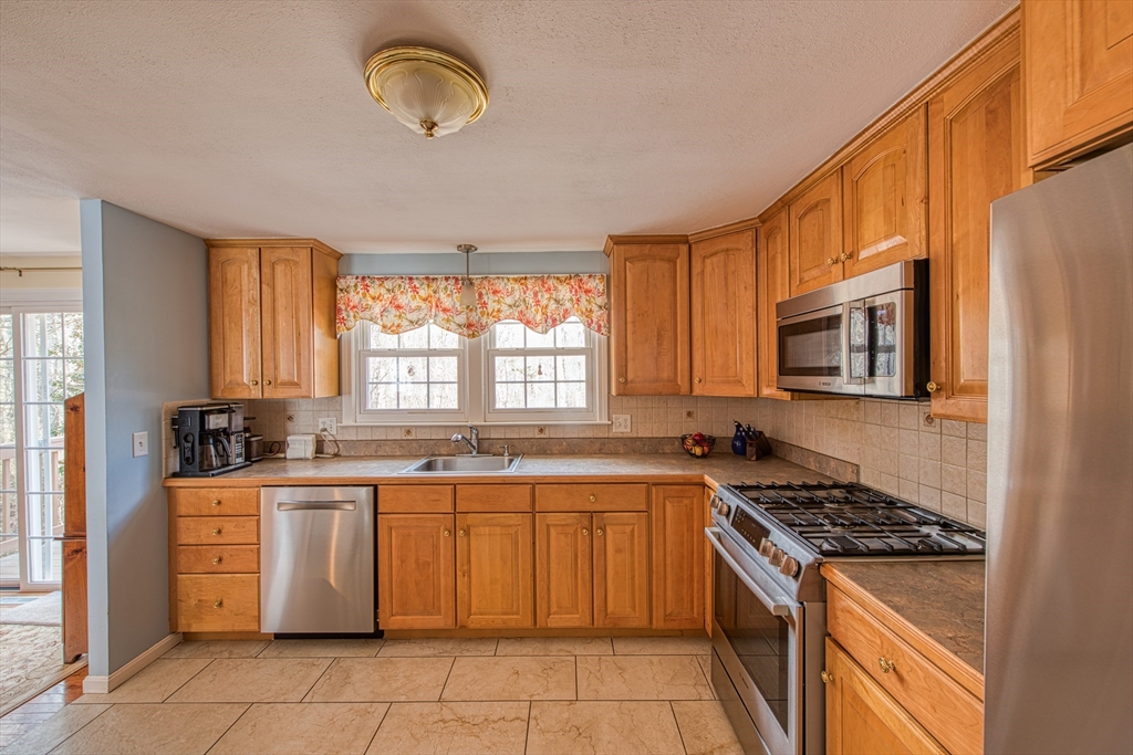 10 Colby Road Bridgewater, MA 02324 - Photo 17 of 42 a kitchen with a stove sink and microwave