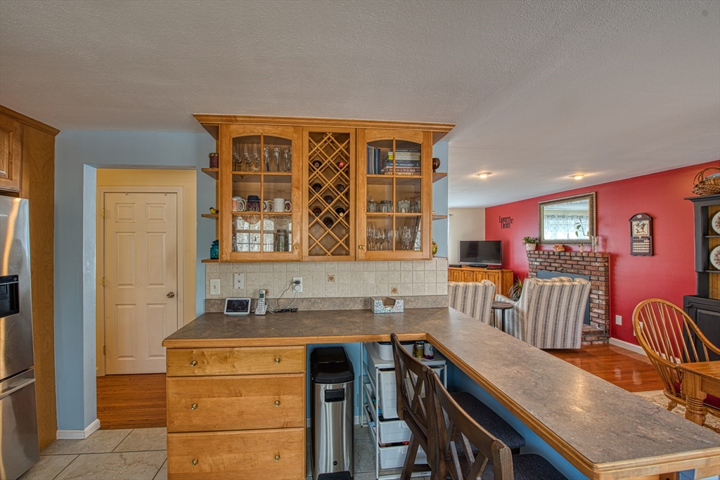 10 Colby Road Bridgewater, MA 02324 - Photo 18 of 42 a kitchen with stainless steel appliances granite countertop a stove a sink and a refrigerator