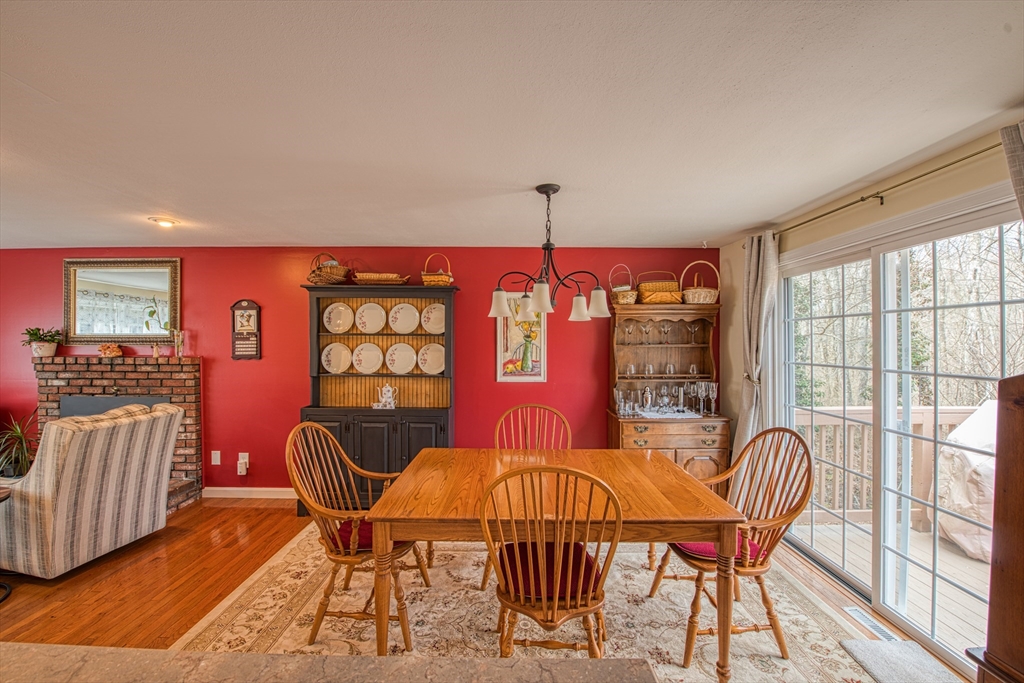 10 Colby Road Bridgewater, MA 02324 - Photo 19 of 42 a dining room with furniture a chandelier and wooden floor