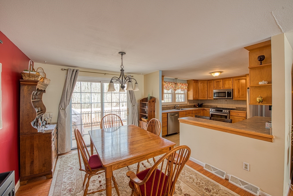 10 Colby Road Bridgewater, MA 02324 - Photo 20 of 42 a view of a dining room with furniture window and wooden floor