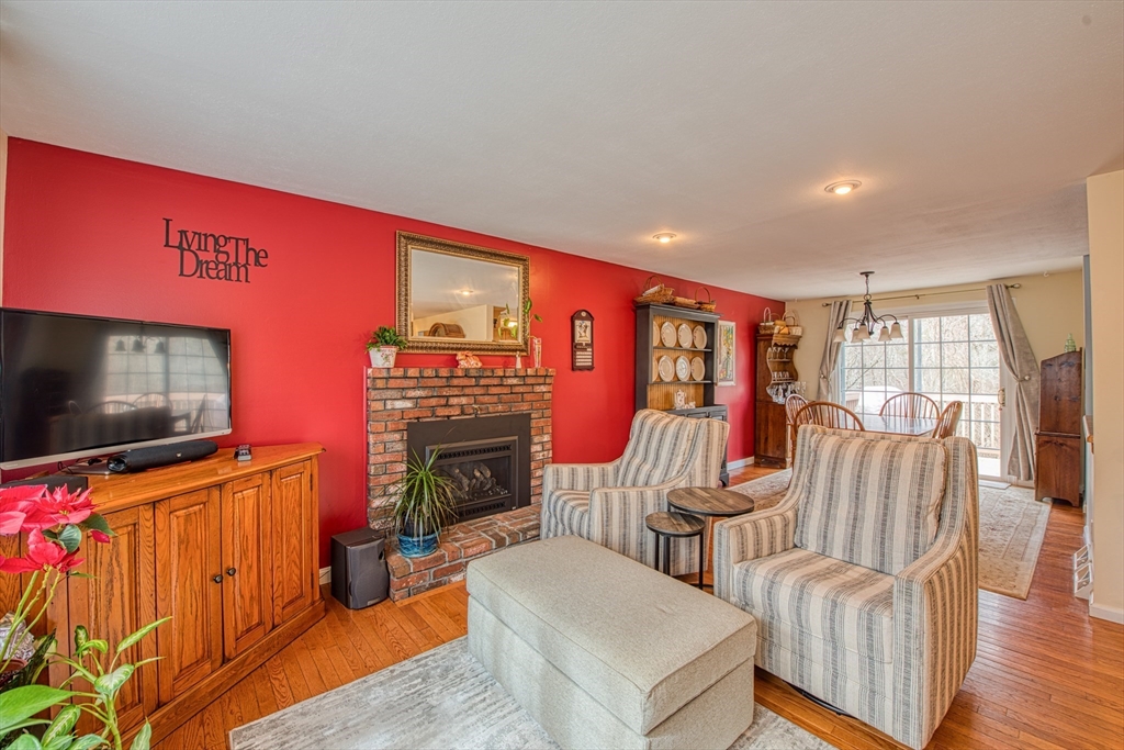 10 Colby Road Bridgewater, MA 02324 - Photo 22 of 42 a living room with furniture and a flat screen tv