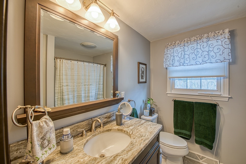 10 Colby Road Bridgewater, MA 02324 - Photo 31 of 42 a bathroom with a granite countertop double vanity sink mirror and toilet