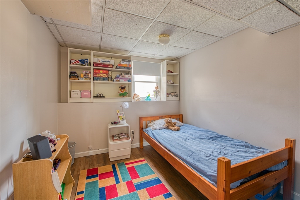 10 Colby Road Bridgewater, MA 02324 - Photo 34 of 42 a bedroom with a bed and wooden floor