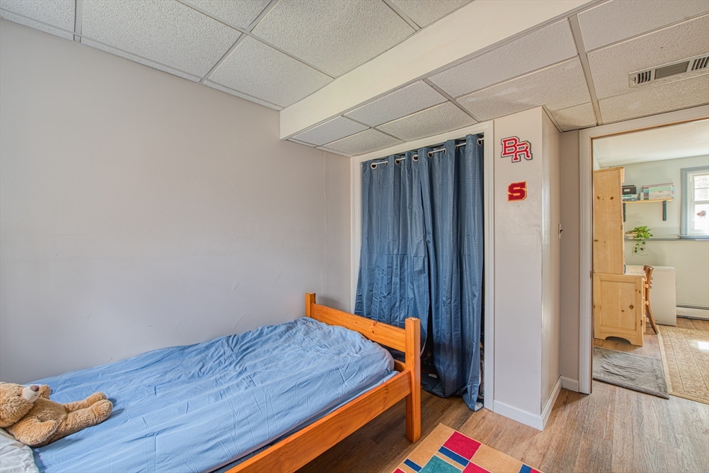 10 Colby Road Bridgewater, MA 02324 - Photo 35 of 42 a room with wooden floor and white walls