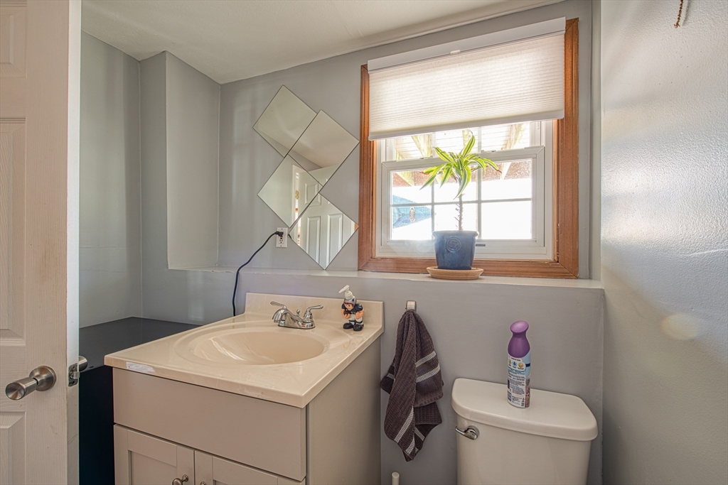 10 Colby Road Bridgewater, MA 02324 - Photo 41 of 42 a bathroom with a sink toilet and a mirror