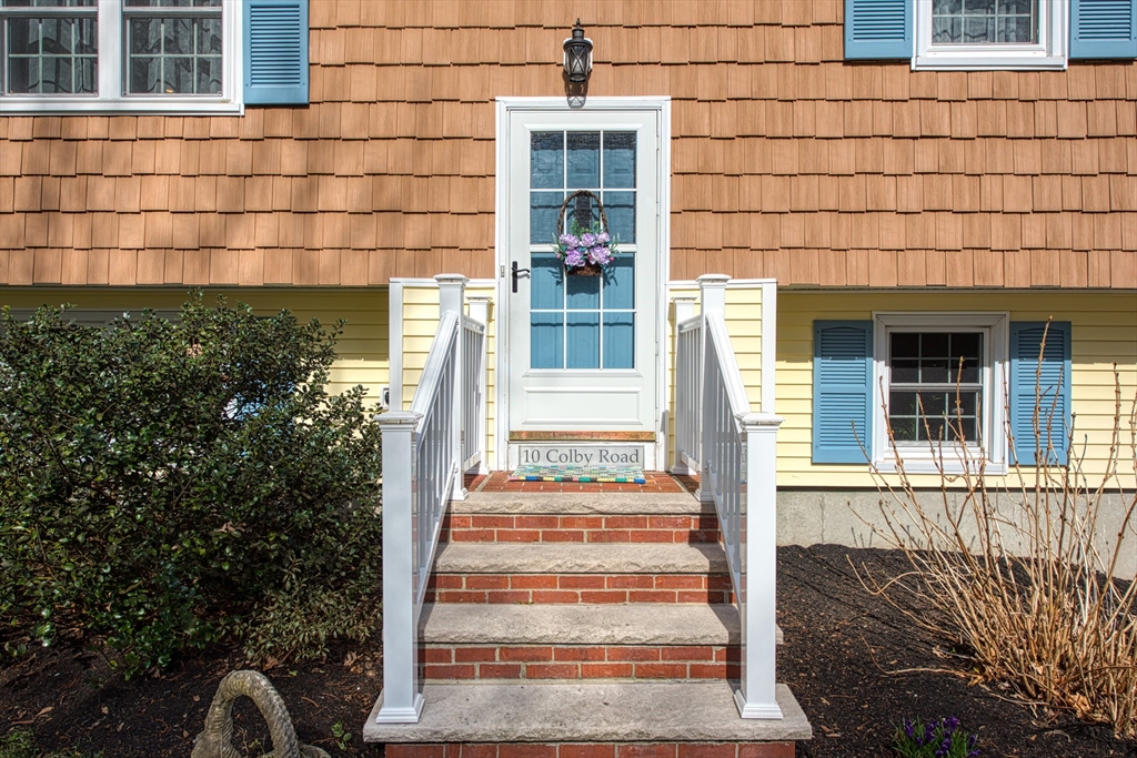 10 Colby Road Bridgewater, MA 02324 - Photo 6 of 42 a front view of a house with a garden