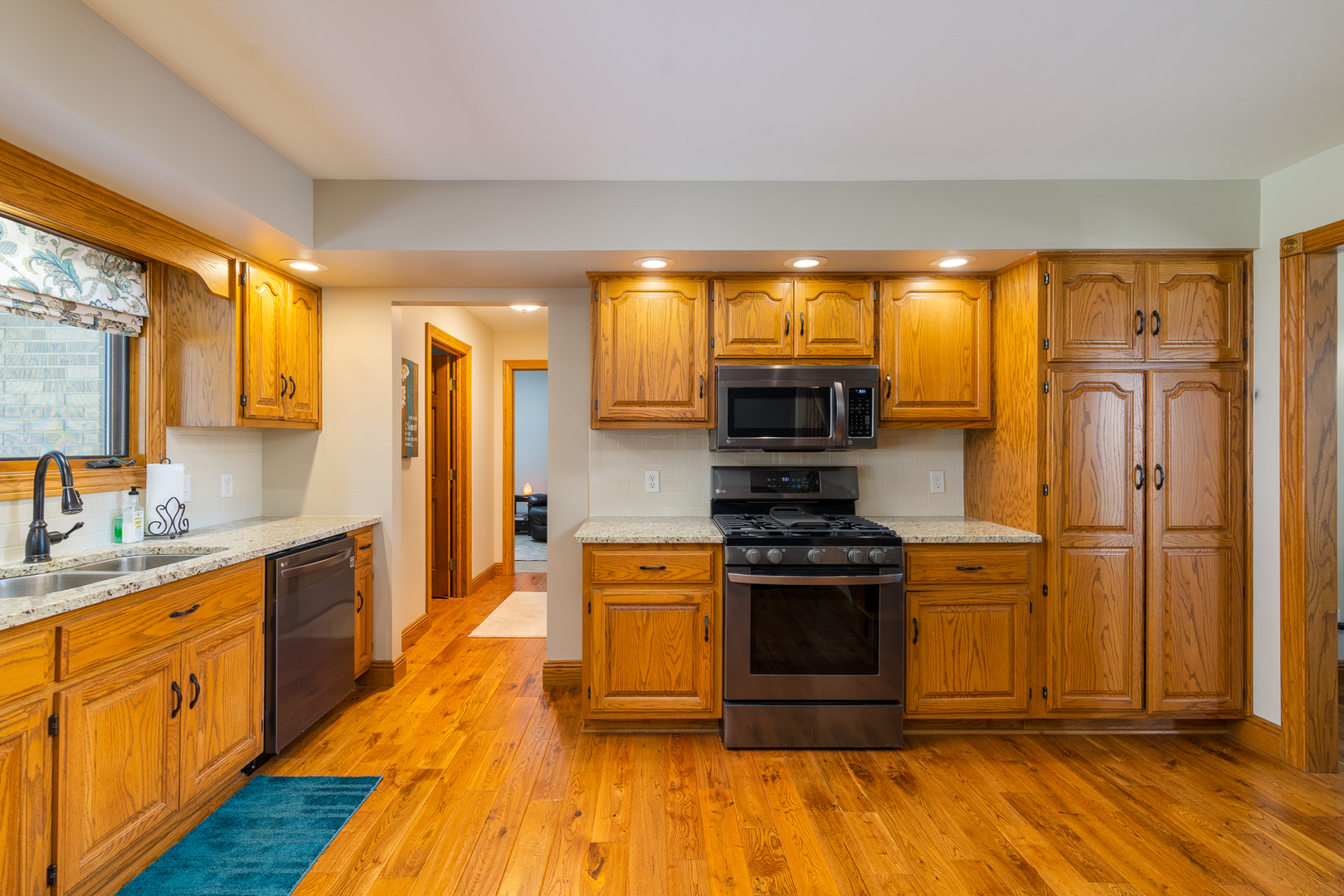 100 Willow Trail Spring Valley, IL 61362 - Photo 19 of 57 a kitchen with stainless steel appliances granite countertop a stove a sink and a refrigerator