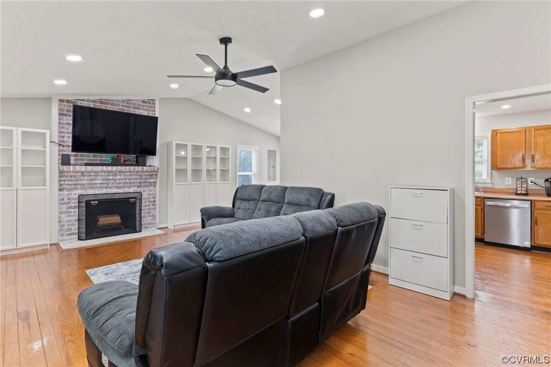 3315 Three Chopt Road Gum Spring, VA 23065 - Photo 4 of 27 a living room with furniture a flat screen tv and a fireplace