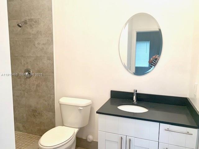 4126 Northwest 3rd Avenue, Unit 4126 Miami, FL 33127 - Photo 12 of 29 a bathroom with a granite countertop sink and a mirror