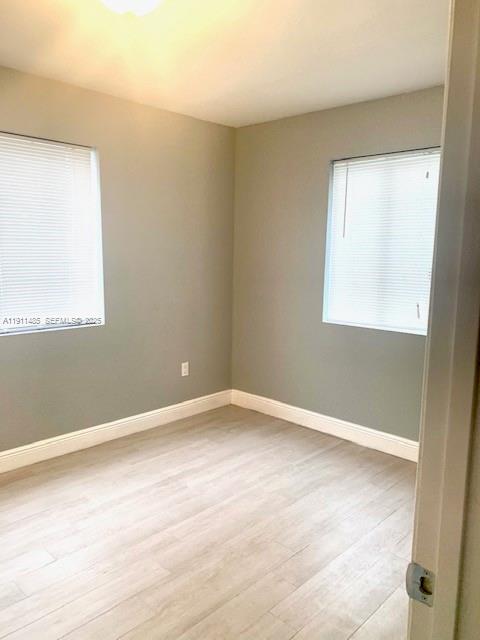 4126 Northwest 3rd Avenue, Unit 4126 Miami, FL 33127 - Photo 16 of 29 an empty room with a window