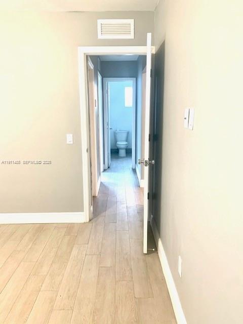 4126 Northwest 3rd Avenue, Unit 4126 Miami, FL 33127 - Photo 23 of 29 a view of a bathroom from a hallway