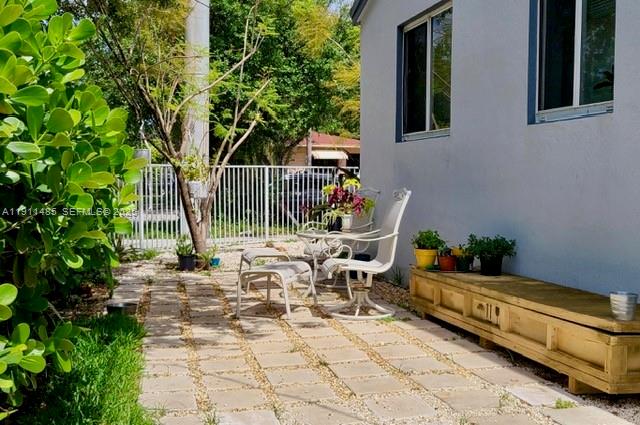 4126 Northwest 3rd Avenue, Unit 4126 Miami, FL 33127 - Photo 28 of 29 a view of backyard with a table and chair