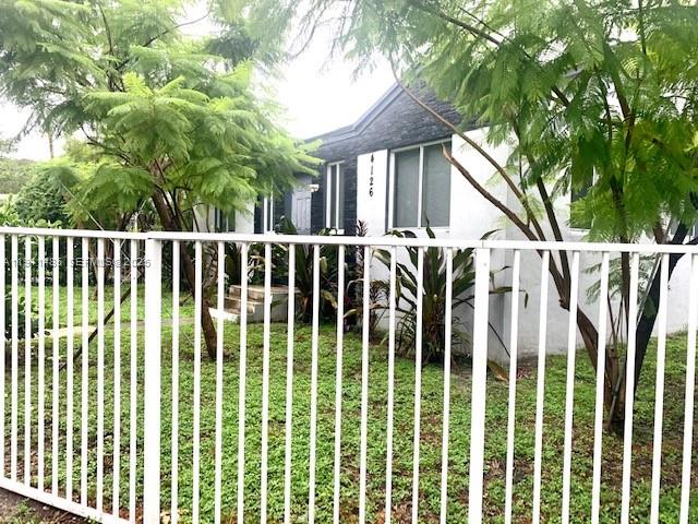 4126 Northwest 3rd Avenue, Unit 4126 Miami, FL 33127 - Photo 29 of 29 a view of a brick house with a large window