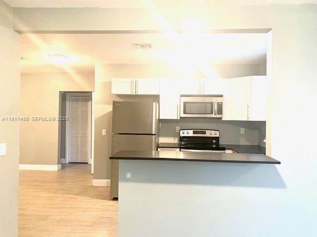 4126 Northwest 3rd Avenue, Unit 4126 Miami, FL 33127 - Photo 10 of 29 a view of a kitchen with a stove