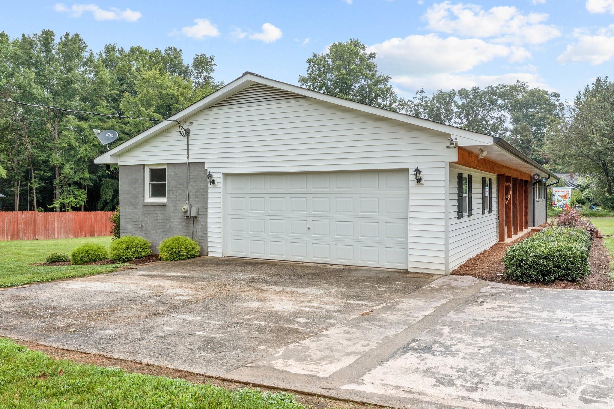 520 Cromer Road Salisbury, NC 28146 - Photo 6 of 48 a front view of a house with a yard and garage