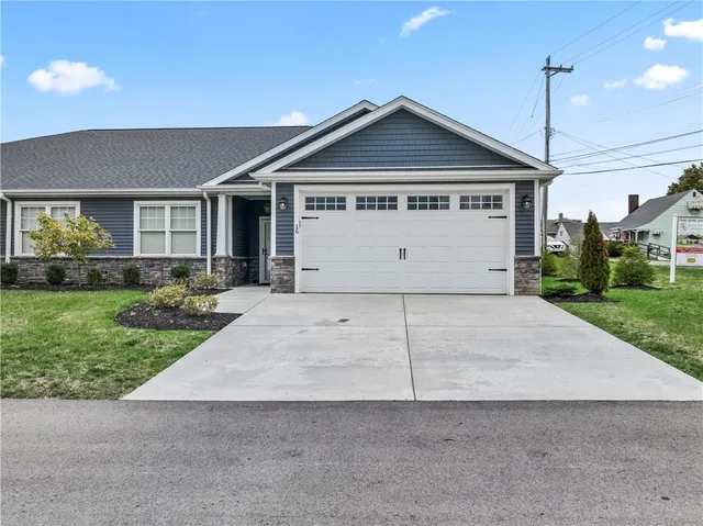 a view of a house with a yard