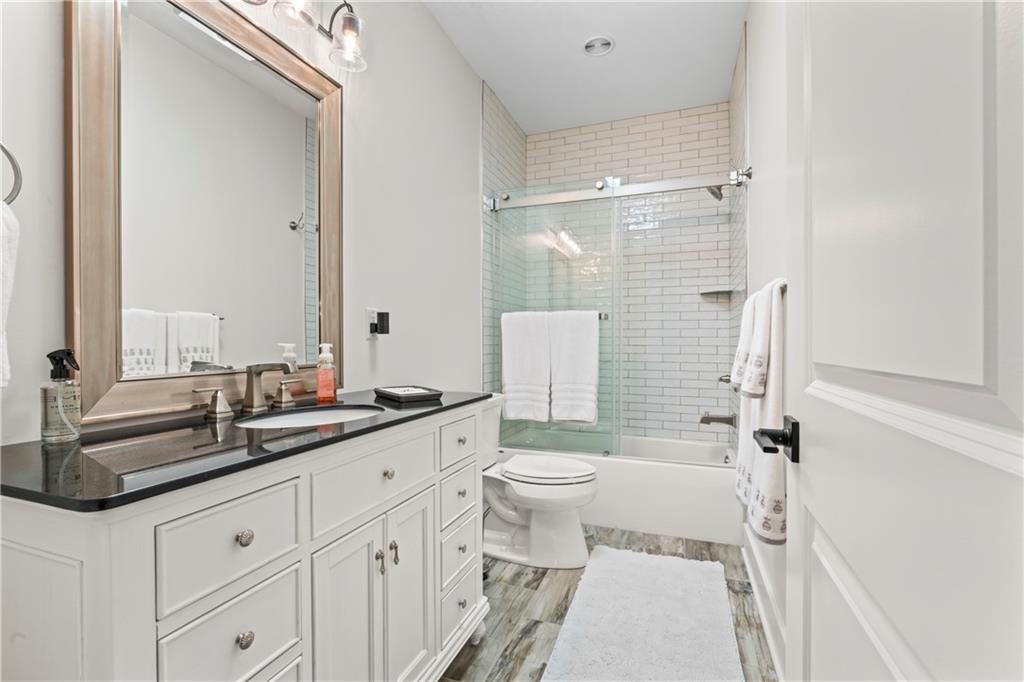 16 Barrington Court Monaca, PA 15061 - Photo 18 of 36 a bathroom with a double vanity sink toilet mirror and shower