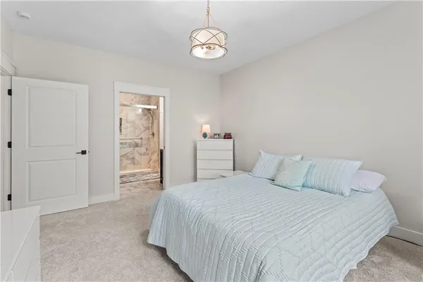 a bedroom with a bed and a table