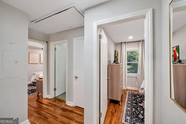 a view of a bedroom with bathroom