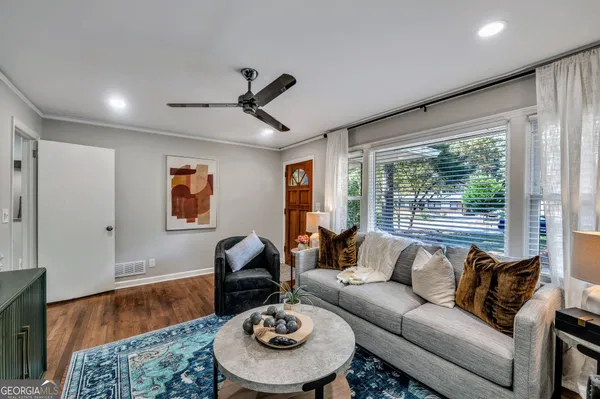 a living room with furniture and a large window
