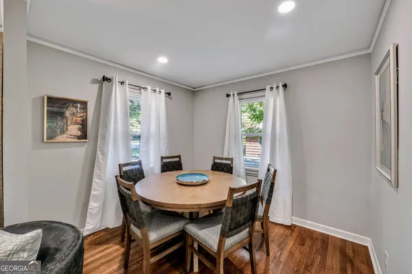 a view of a dining room with furniture window and outside view