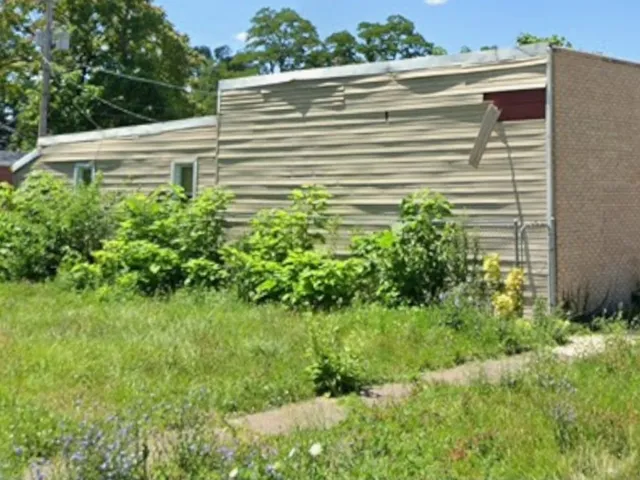 a view of a backyard of the house