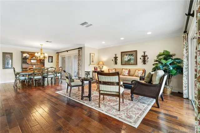 a living room with stainless steel appliances kitchen island granite countertop furniture and a kitchen view