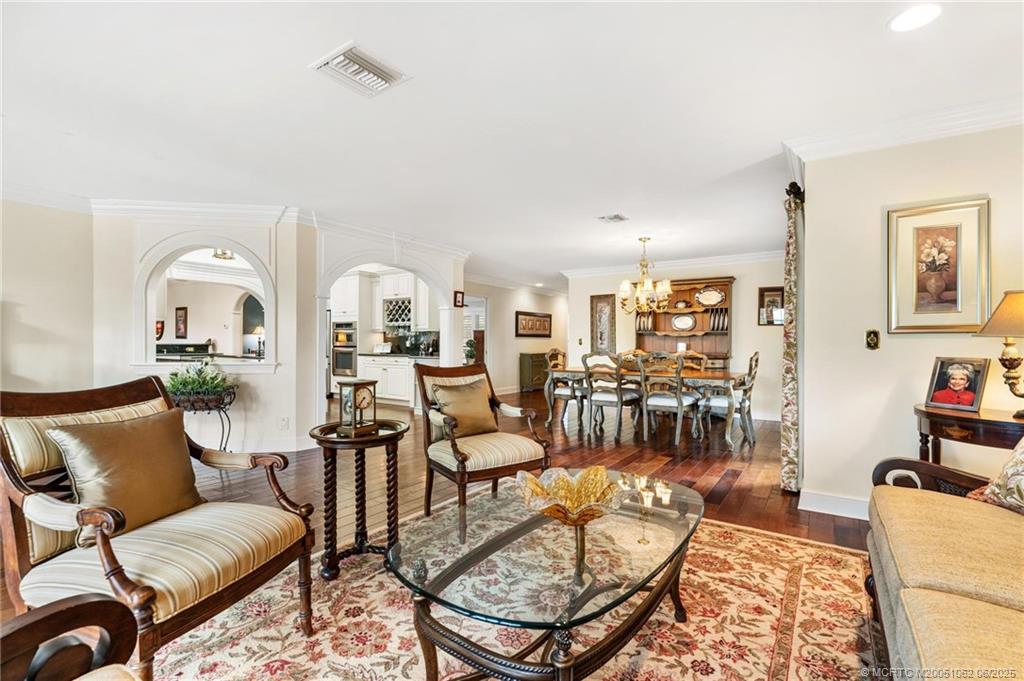 3192 Southeast Fairway West Stuart, FL 34997 - Photo 12 of 76 a living room with lots of furniture and view of pool