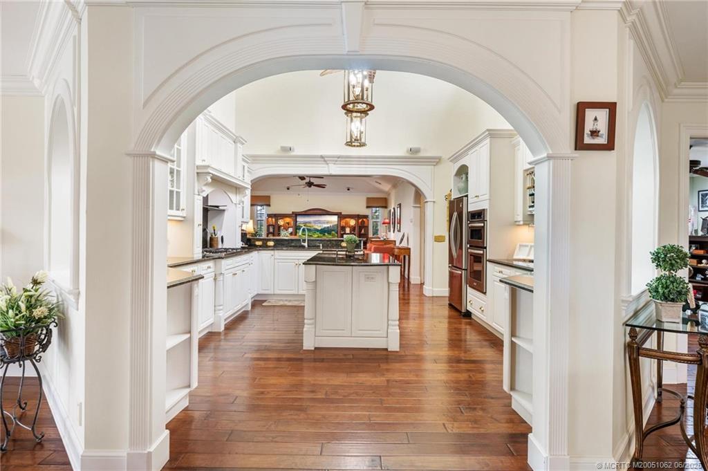 3192 Southeast Fairway West Stuart, FL 34997 - Photo 13 of 76 a living room with stainless steel appliances kitchen island granite countertop furniture and a kitchen view