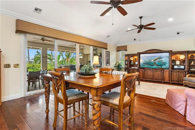 a living room with furniture a rug and a large window