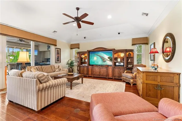 a spacious bedroom with a bed and glass walk in closet