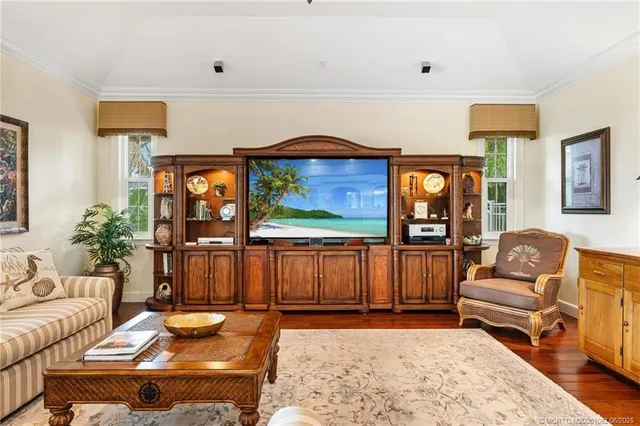 a bedroom with a bed and ceiling fan