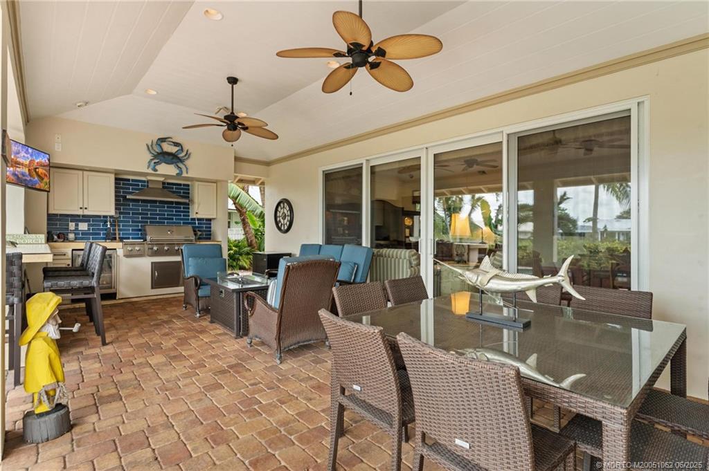 3192 Southeast Fairway West Stuart, FL 34997 - Photo 45 of 76 a view of a dining room with furniture window and outside view