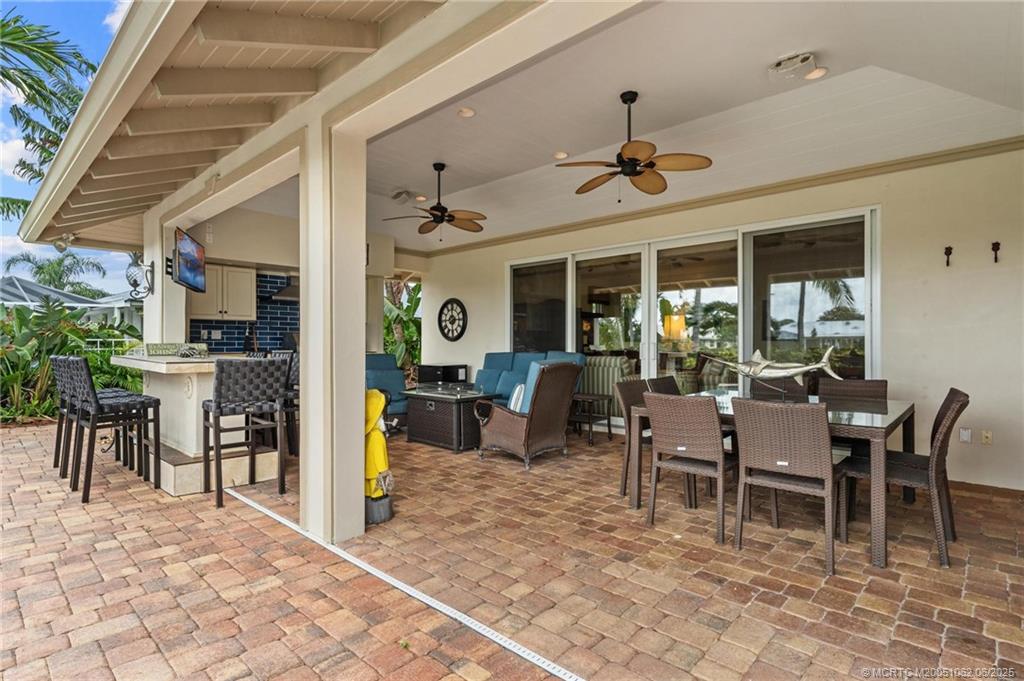 3192 Southeast Fairway West Stuart, FL 34997 - Photo 48 of 76 a view of a dining room with furniture window and outside view