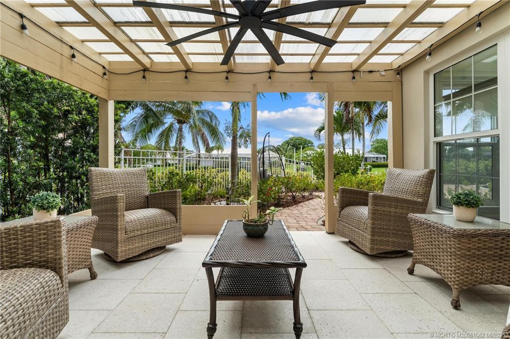 3192 Southeast Fairway West Stuart, FL 34997 - Photo 53 of 76 a building outdoor space with patio furniture and potted plants