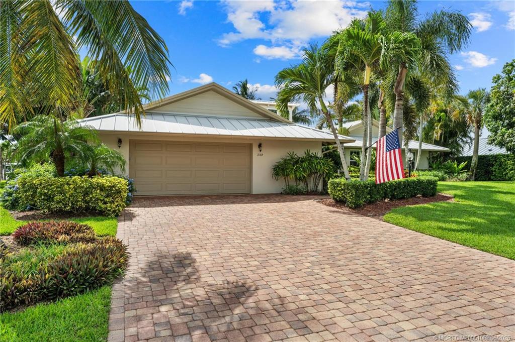3192 Southeast Fairway West Stuart, FL 34997 - Photo 72 of 76 a front view of house with yard and green space
