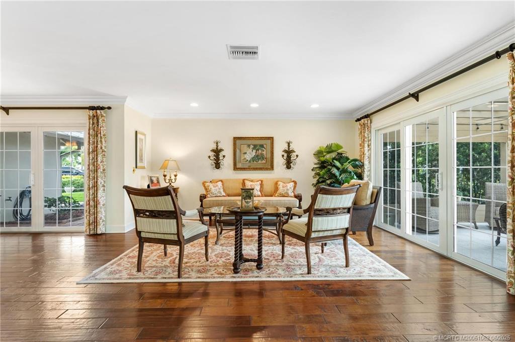 3192 Southeast Fairway West Stuart, FL 34997 - Photo 10 of 76 a view of a dining room with furniture and wooden floor