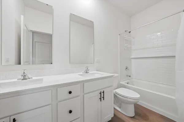 a bathroom with a sink toilet a vanity and shower