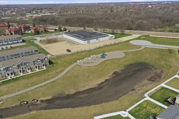 an aerial view of residential houses with outdoor space