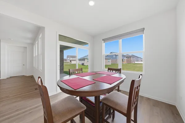 a dining room with furniture and window