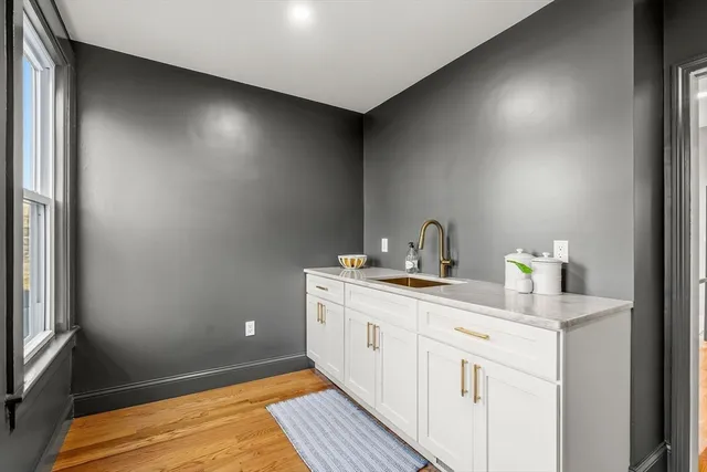a kitchen with a sink and cabinets