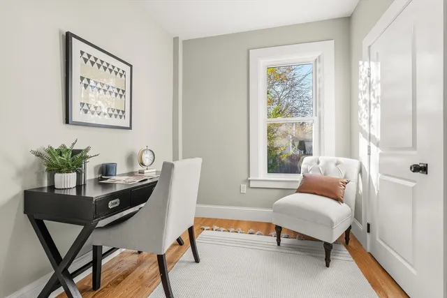 a work room with furniture and a window