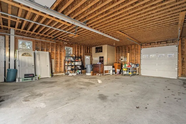 a front view of a house with a garage
