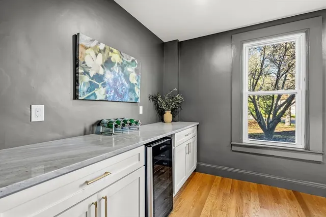 a kitchen with stainless steel appliances granite countertop a stove a sink and a window