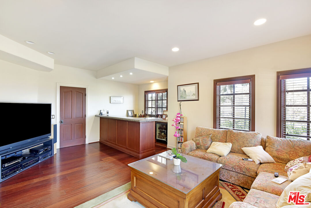480 Westlake Boulevard Malibu, CA 90265 - Photo 16 of 36 a living room with furniture and a flat screen tv
