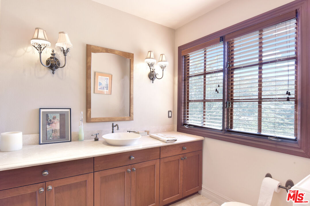 480 Westlake Boulevard Malibu, CA 90265 - Photo 23 of 36 a bathroom with a sink mirror and window