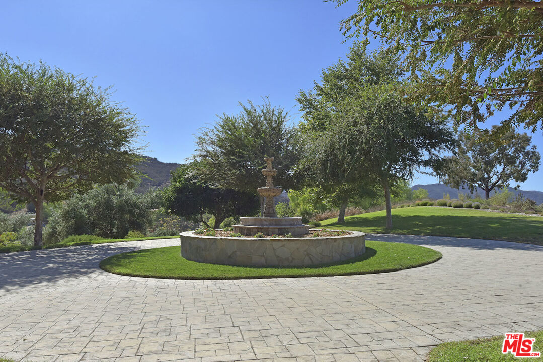 480 Westlake Boulevard Malibu, CA 90265 - Photo 32 of 36 a view of a fountain with a big yard