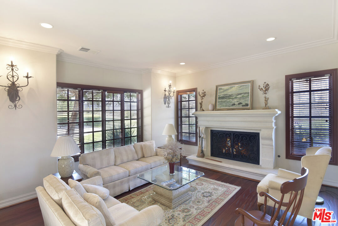 480 Westlake Boulevard Malibu, CA 90265 - Photo 5 of 36 a living room with furniture and a fireplace